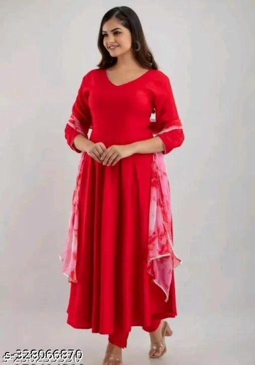Red rayon anarkali gown with intricate tessels, solid net pattern, three-quarter sleeves