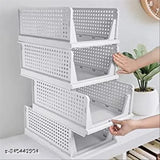 White, stackable clothes organizer with four layers in a wardrobe cupboard, featuring clear storage drawers