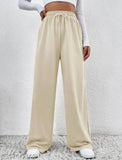 Tan pants, white top