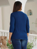 A blue topper on a woman walking