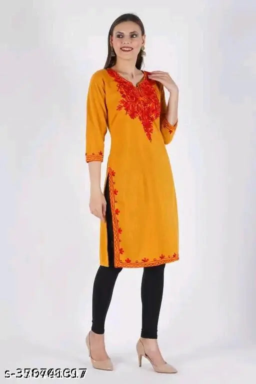 Woman in yellow kameez with patterned pants