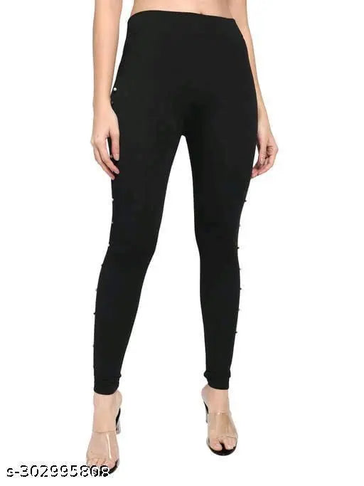 Solid black poly-cotton jeggings with side stones, stylish regular fit for women and girls. Elastic waist band, comfortable stretch fabric, perfect for casual or formal wear. Made in India