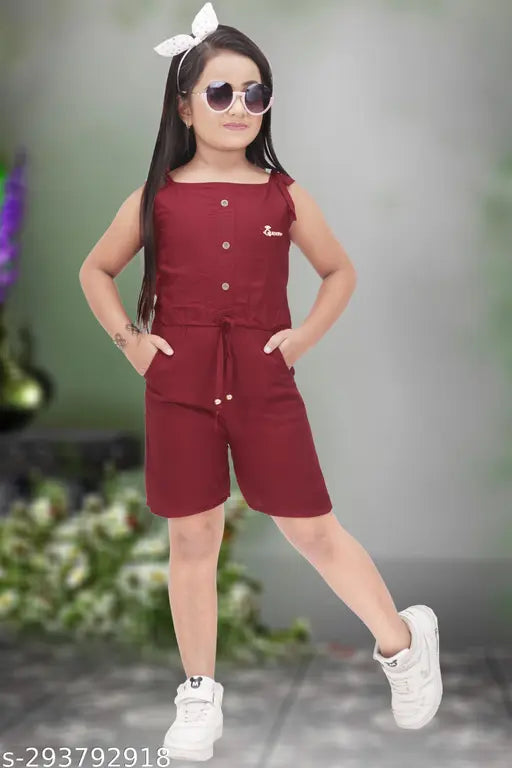 Young girl in maroon romper with sunglasses, posing