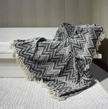 Gray fringed zig zag throw blanket