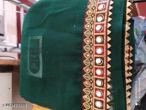 Green georgette saree with red and gold border
