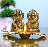 Golden metal Ganesha Lakshmi statue with diya, decorative Indian showpiece (15cm)