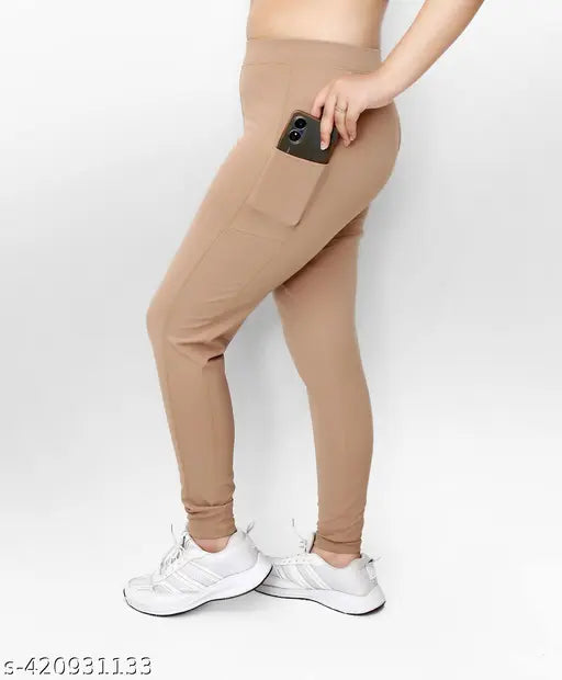 Trendy beige polyester women's pocket jeggings, stylish denim-look with high waist and pockets