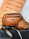A pair of stylish women's sling bags, one larger and one smaller, in a dark brown color with a zip closure