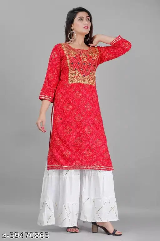 Red rayon kurta with sharara pants, long embroidered sleeves, and round neck