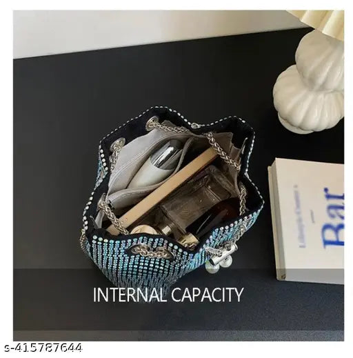 A small women's clutch bag with drawstring closure, rhinestone accents, and a crossbody strap