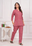 Women's printed rayon night suit set, three-quarter sleeves, pyjama style on hanging rack