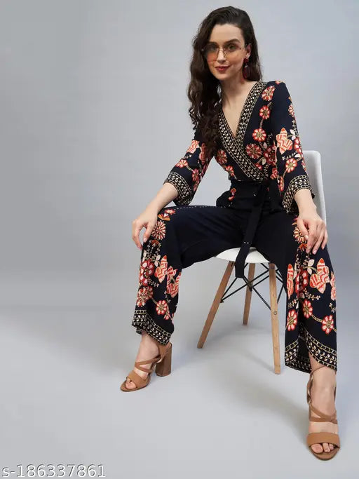 Black rayon floral v-neck jumpsuit with three-quarter sleeves, printed pattern, suitable for women sizes S-XXL. Fashionable Indian-made style