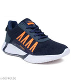 Black and blue sports running shoes with orange accents, designed for boys, featuring comfortable soles and a breathable upper material