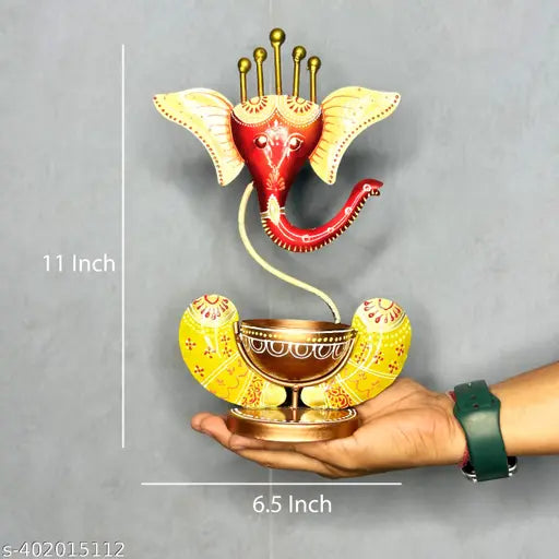 Metal Ganesha T-Light Holder, handcrafted Indian artistry, illuminates sacred spaces with spiritual elegance