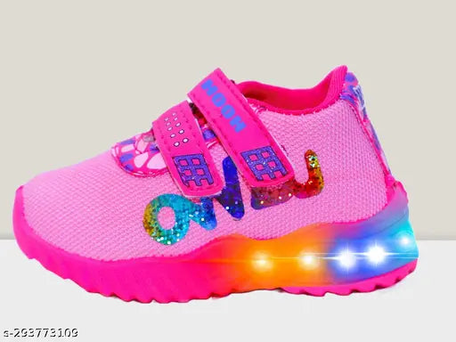 Pink kids shoes with glitter, black laces, white soles