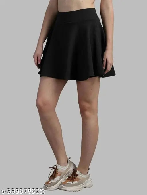 High-quality polyester skater skirt with attached inner shorts and flared inskirt, solid color, comfortable for sports, double layer, elastic pull on closure, wide waistband, A-line silhouette, laser cutout scallop hem, made in India