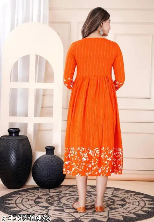 Orange long-sleeved tunic dress with floral design and v-neck