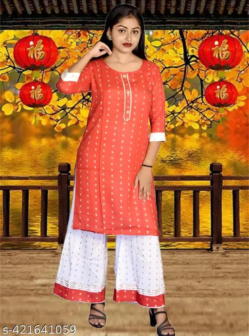Casual cotton blend kurti plazo sets with printed patterns and three-quarter sleeves, available in various sizes for girls aged 7-14 years. Indian-made fashion dresses for women and children