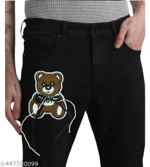 Men's fashion black denim jeans with a small teddy bear applique