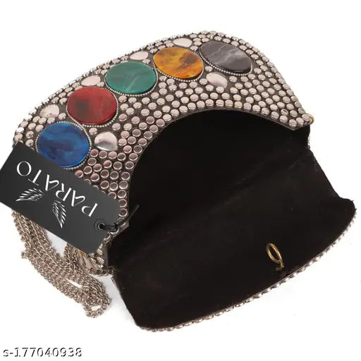 This is a silver metallic clutch purse with gold accents, featuring a design that suggests the appearance of a bag or sling. It has a sturdy chain-link shoulder strap for carrying over the shoulder