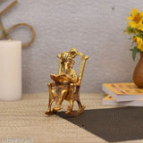 Antique golden brass Ganesha statue reading book, seated Ganesh idol on a chair