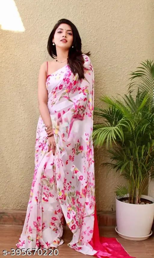 White georgette saree with floral print, paired with blouse piece, elegant and vibrant attire for women