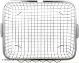 Stainless steel dish rack in kitchen, holding utensils and containing drainer basket, metal tool holder