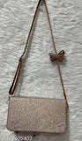 Black glittery leather sling bag, with long strap and brown accent, perfect for everyday carryall