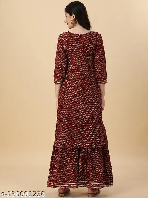 Red women's kameez with embellished sleeves and long skirt, traditional Indian wear