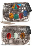 Gold-toned metal clutch with colorful stones, multiple pockets