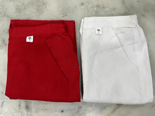 White cotton pants, stack of three in a neat arrangement