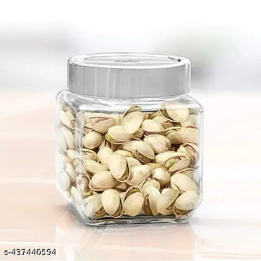 Clear glass jar, filled with white almonds