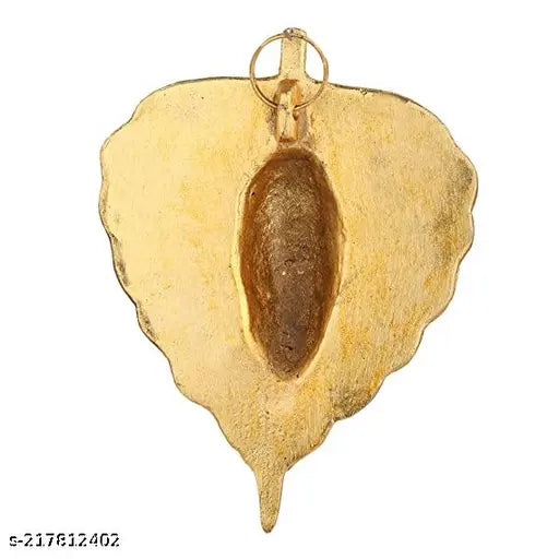 Green metal finish Peepal leaf Ganesh idol, traditional style wall hanging decor. Handcrafted with antique silver finish and gold plated details, perfect for worship or home decor. Measures approximately 9.5cm (L) x 13cm (H) x 2.5cm (B). Origin: India