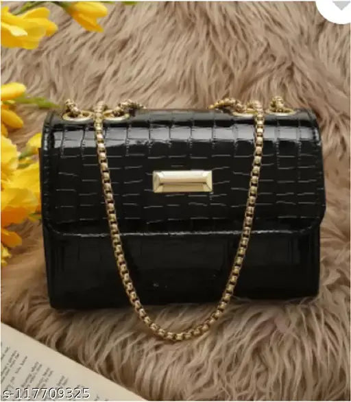 Black leather purse with golden chain strap and visible logo on side