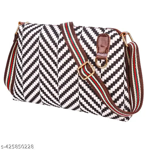 Black zigzag patterned waterproof sling bag with adjustable strap and multiple pockets