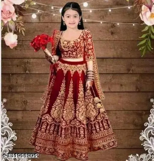 Embroidered velvet LENGHA CHOLI for kids in various sizes, rich Indian fabric on display