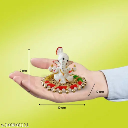 Decorative brass oil lamp with round crystal and lotus motif, deepak style, for puja or meditation. Includes white pagadi Ganesh statue and gold plated palte