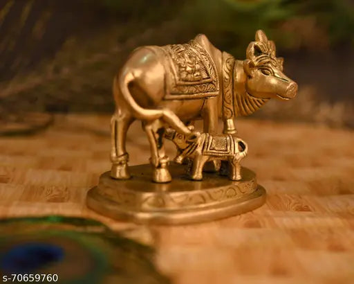 Handmade brass Kamdhenu Nandi cow statue with golden finish, traditional Indian animal showpiece gift