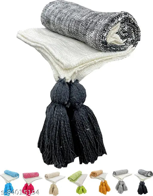 High-quality 100% cotton fashion throw (140 x 170 cm), perfect for sofas, chairs, or picnics, featuring designer pattern and tassels. Made in India, washable by hand or dry clean