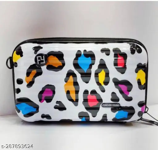 A mini suitcase-style sling bag with a colorful leopard print pattern, suitable for travel or daily use. This unisex portable bag can be carried over the shoulder and has a side pocket
