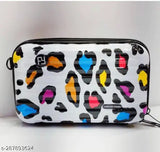 A mini suitcase-style sling bag with a colorful leopard print pattern, suitable for travel or daily use. This unisex portable bag can be carried over the shoulder and has a side pocket
