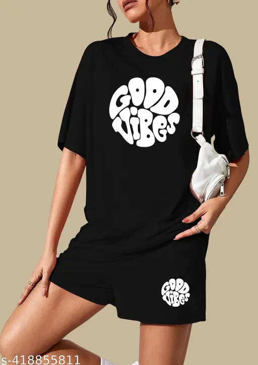 Black pure cotton printed night suit set for women, featuring a top and shorts with short sleeves. Perfect for relaxing at home, made in India