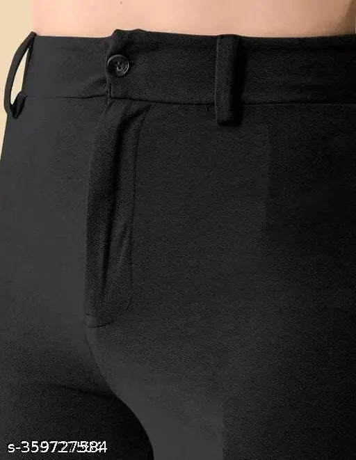 Black cotton bell-bottom pants with solid color and zip closure