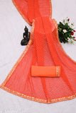 Orange soft georgette saree with detailed embroidery and lace detailing on borders
