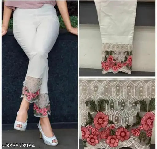 Women's white pants with red flowers decorative detail