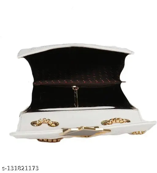 White sling bag with gold accents