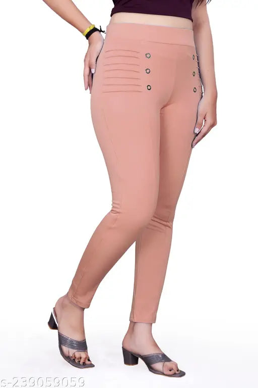 Pink Cotton Lycra jeggings, high rise, straight leg, ankle length, elastic waist, front seam detail, pleated at front, classy steel button attached. Women's skin fit pant, made in India, size options available