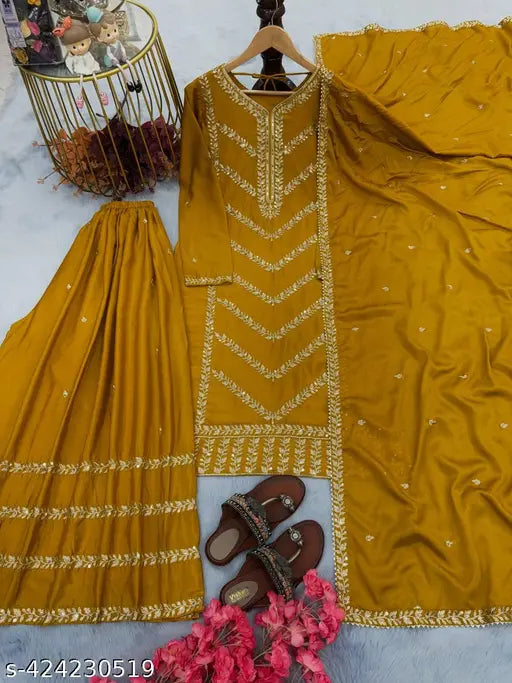 Gold silk suit and coordinating dupatta with intricate border design