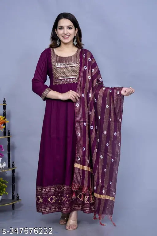 Purple rayon yug with zari woven net, cotton cambric dupatta. Large women's traditional Indian garment in wine gold color, multiple size options available