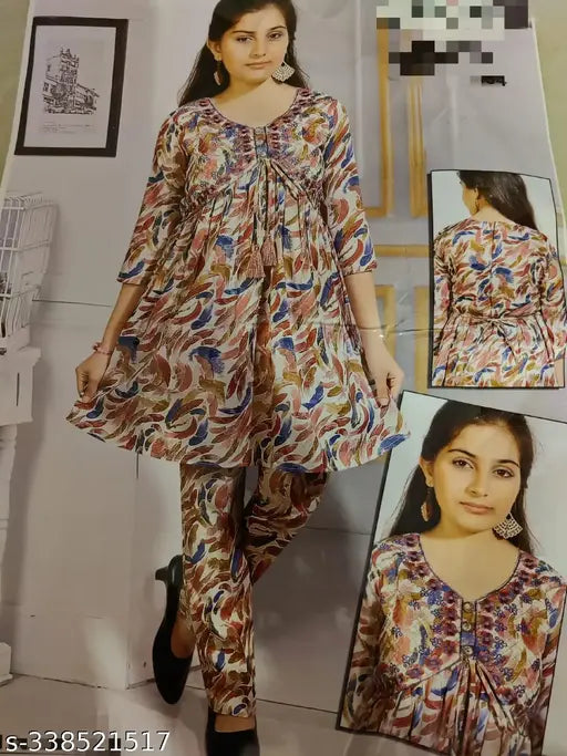 Bright, printed rayon anarkali top with matching pyjamas, featuring heavy embroidery, tassels, and fancy buttons. Indo-western Aliya Coord set in attractive floral print, suitable for kids aged 4-9 years